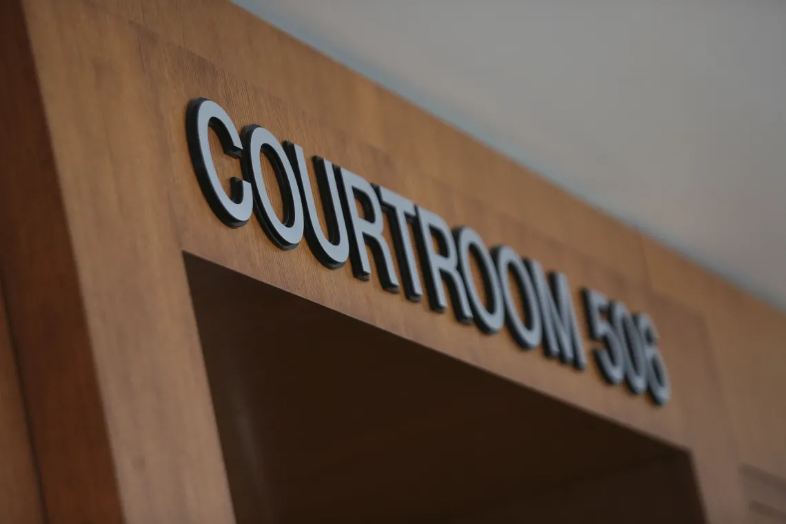 Close-up of a "Courtroom" sign