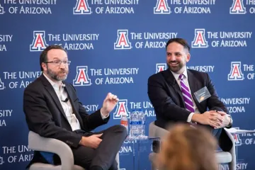 Chris Griffin talking with keynote speaker Alexander MacDonald